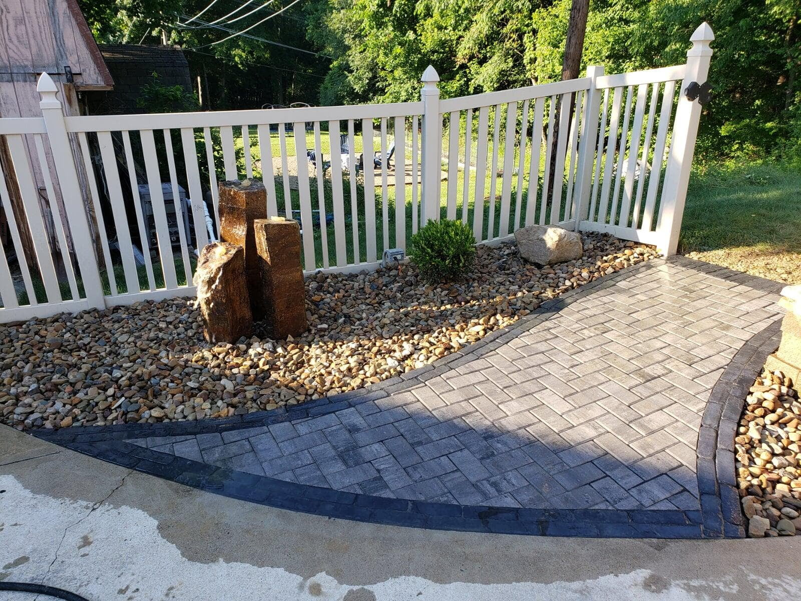 A comfortable walkway with pondless water feature